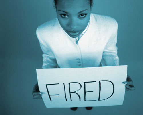 Businesswoma Holding Fired Sign Board